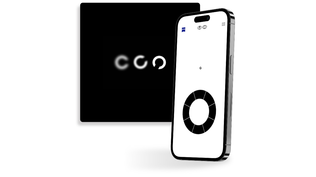 Smartfon z ekranem przedstawiającym przesiewowy test wzroku ZEISS, stojący przed czarnym kwadratowym przyciskiem, na którym widać różne ostre koła z otworem w wielu kierunkach, powszechnie stosowane w badaniach wzroku.