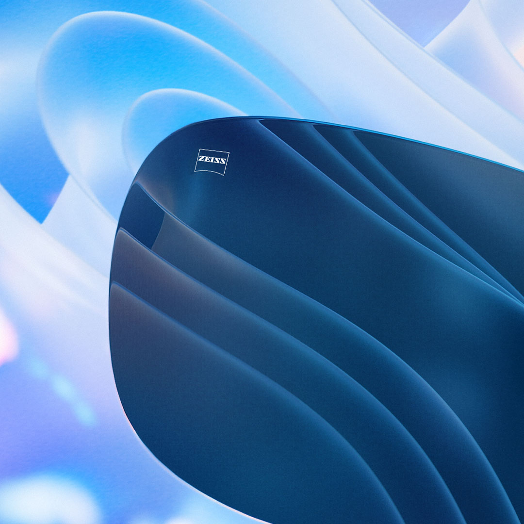 Wygenerowana komputerowo wizualizacja barwionej soczewki skutecznie blokującej odblaski widoczne w tle.