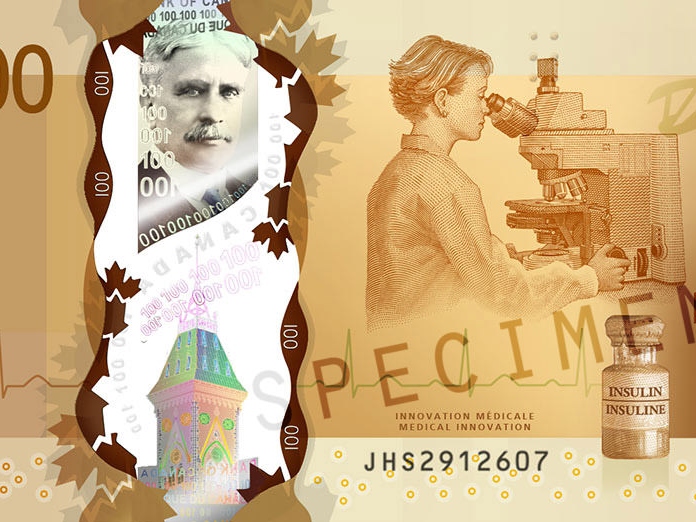 Zbliżenie na kanadyjski banknot $100, przedstawiający mikroskop ZEISS pośród innych przedmiotów.